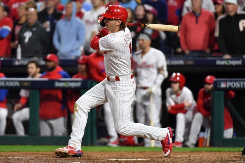 Oct 24, 2023; Philadelphia, Pennsylvania, USA; Philadelphia Phillies second baseman Bryson Stott (5) hits a RBI double against the Arizona Diamondbacks in the fourth inning during game seven of the NLCS for the 2023 MLB playoffs at Citizens Bank Park. Mandatory Credit: Eric Hartline-USA TODAY Sports