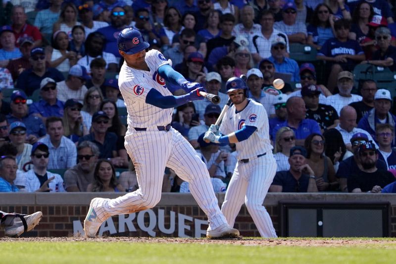 Aug 7, 2024; Chicago, Illinois, USA; Chicago Cubs catcher Christian Bethancourt (60) hits a one run double against the Minnesota Twins during the eighth inning at Wrigley Field. Mandatory Credit: David Banks-USA TODAY Sports
