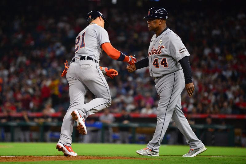 Sep 15, 2023; Anaheim, California, USA; Detroit Tigers shortstop Javier Baez (21) is greeted by third base coach Gary Jones (44) after hitting a solo home run against the Los Angeles Angels during the third inning at Angel Stadium. Mandatory Credit: Gary A. Vasquez-USA TODAY Sports