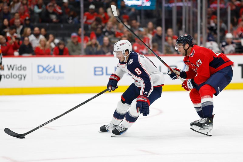 Nov 2, 2024; Washington, District of Columbia, USA; Columbus Blue Jackets defenseman Zach Werenski (8) skates with the puck in fro t of Washington Capitals right wing Tom Wilson (43) in the third period at Capital One Arena. Mandatory Credit: Geoff Burke-Imagn Images