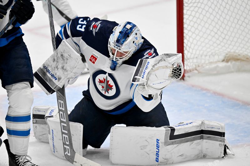 Apr 11, 2024; Dallas, Texas, USA; Winnipeg Jets goaltender Laurent Brossoit (39) makes a glove save on a Dallas Stars shot during the second period at the American Airlines Center. Mandatory Credit: Jerome Miron-USA TODAY Sports