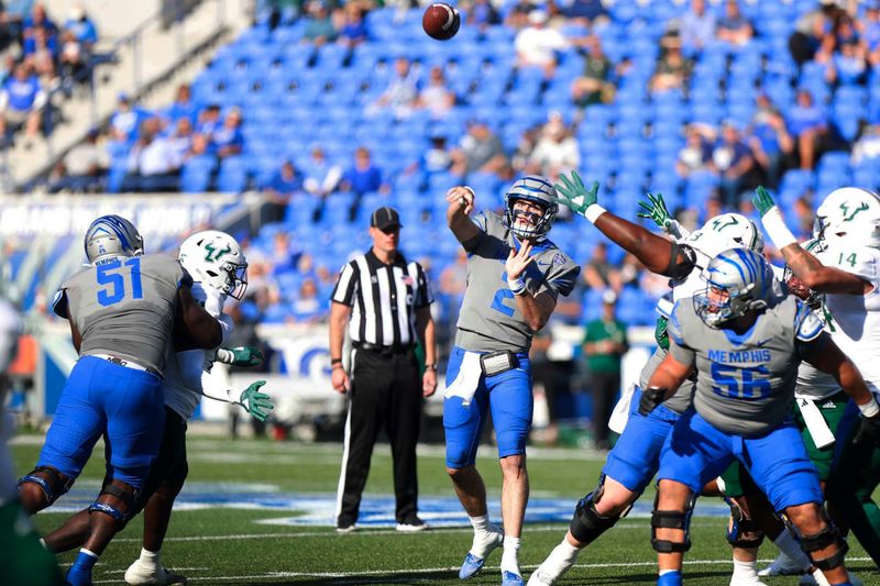 Nov 4, 2023; Memphis, Tennessee, USA;  Memphis Tigers  Seth Henigan (4) throws the ball against South Florida at Simmons Bank Liberty Stadium. Mandatory Credit: Stu Boyd II-USA TODAY Sports