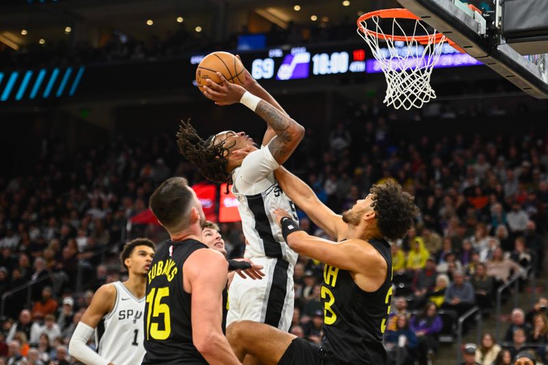 SALT LAKE CITY, UTAH - OCTOBER 31: Stephon Castle #5 of the San Antonio Spurs shoots over Johnny Juzang #33 of the Utah Jazz during the second half of a game at Delta Center on October 31, 2024 in Salt Lake City, Utah. NOTE TO USER: User expressly acknowledges and agrees that, by downloading and or using this photograph, User is consenting to the terms and conditions of the Getty Images License Agreement. (Photo by Alex Goodlett/Getty Images)