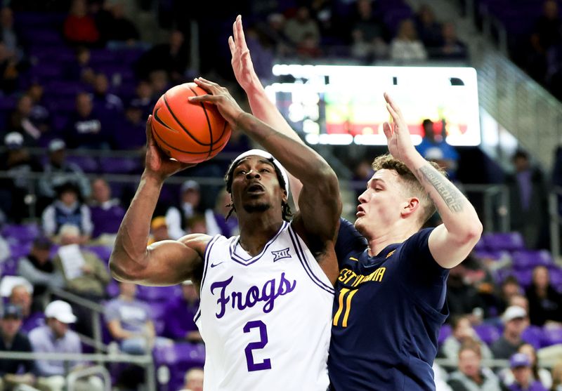 Feb 12, 2024; Fort Worth, Texas, USA;  TCU Horned Frogs forward Emanuel Miller (2) shoots as West Virginia Mountaineers forward Quinn Slazinski (11) defends during the first half at Ed and Rae Schollmaier Arena. Mandatory Credit: Kevin Jairaj-USA TODAY Sports