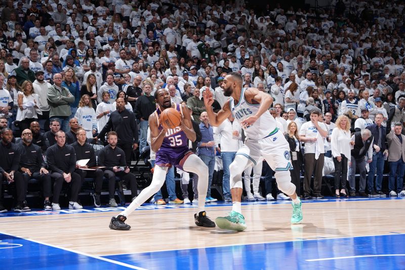 MINNEAPOLIS, MN -  APRIL 20: Kevin Durant #35 of the Phoenix Suns handles the ball during Round One Game One of the 2024 NBA Playoffs against the Minnesota Timberwolves on April 20, 2024 at Target Center in Minneapolis, Minnesota. NOTE TO USER: User expressly acknowledges and agrees that, by downloading and or using this Photograph, user is consenting to the terms and conditions of the Getty Images License Agreement. Mandatory Copyright Notice: Copyright 2024 NBAE (Photo by Jordan Johnson/NBAE via Getty Images)