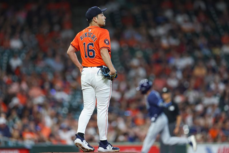 Aug 2, 2024; Houston, Texas, USA; Houston Astros starting pitcher Yusei Kikuchi (16) reacts and Tampa Bay Rays left fielder Dylan Carlson (10) rounds the bases after hitting a home run during the first inning at Minute Maid Park. Mandatory Credit: Troy Taormina-USA TODAY Sports