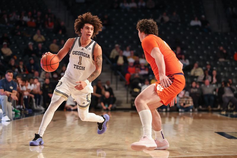 Jan 14, 2025; Atlanta, Georgia, USA; Clemson Tigers forward Ian Schieffelin (4) plays defense against Georgia Tech Yellow Jackets guard Naithan George (1) during the first half at McCamish Pavilion. Mandatory Credit: Jordan Godfree-Imagn Images