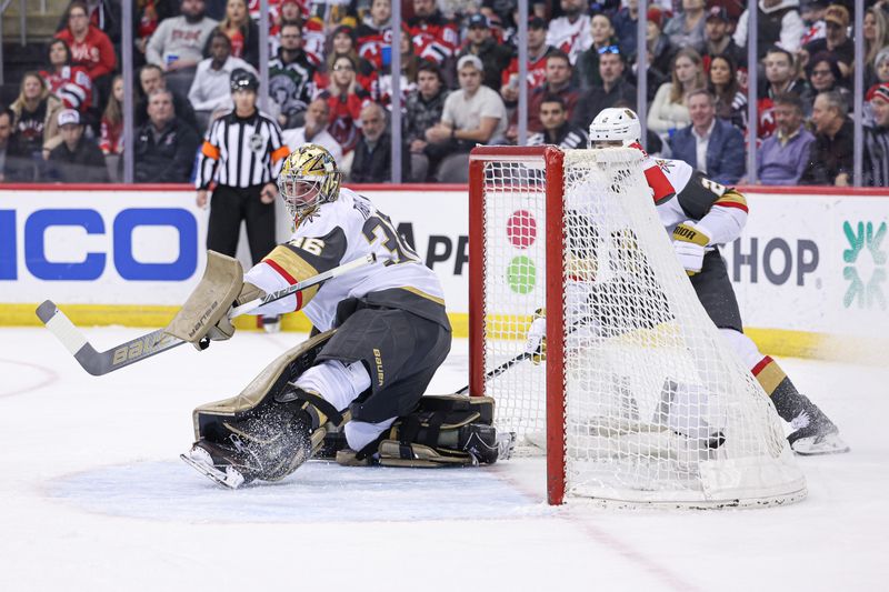 Jan 22, 2024; Newark, New Jersey, USA; (Editors Notes: Caption Correction) Vegas Golden Knights goaltender Logan Thompson (36) looks back at a goal scored by New Jersey Devils center Nico Hischier (not pictured) during the first period at Prudential Center. Mandatory Credit: Vincent Carchietta-USA TODAY Sports