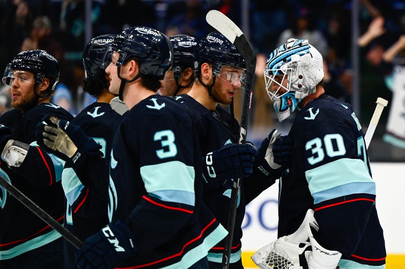 Oct 29, 2022; Seattle, Washington, USA; The Seattle Kraken celebrate after defeating the Pittsburgh Penguins at Climate Pledge Arena. Seattle won 3-1. Mandatory Credit: Steven Bisig-USA TODAY Sports