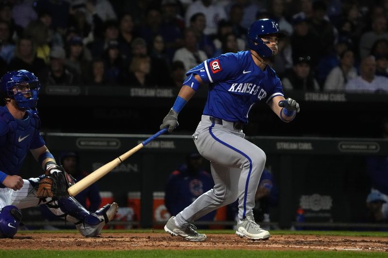 Mar 6, 2025; Mesa, Arizona, USA; Kansas City Royals second base Michael Massey (19) hits a RBI double against the Chicago Cubs in the third inning at Sloan Park. Mandatory Credit: Rick Scuteri-Imagn Images
