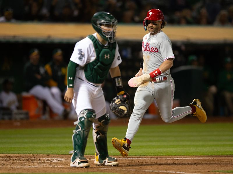 Jun 16, 2023; Oakland, California, USA; Philadelphia Phillies designated hitter Bryce Harper (3) scoress during the ninth inning against the Oakland Athletics at Oakland-Alameda County Coliseum. Mandatory Credit: D. Ross Cameron-USA TODAY Sports