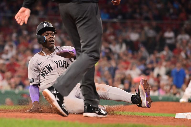 Jul 28, 2024; Boston, Massachusetts, USA; New York Yankees center fielder Jazz Chisholm Jr (13) steals third base against the Boston Red Sox during the ninth inning at Fenway Park. Mandatory Credit: Eric Canha-USA TODAY Sports