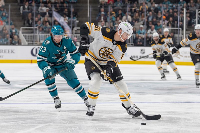 Mar 22, 2025; San Jose, California, USA;  Boston Bruins defenseman Nikita Zadorov (91) controls the puck during the second period against San Jose Sharks center Tyler Toffoli (73) at SAP Center at San Jose. Mandatory Credit: Stan Szeto-Imagn Images