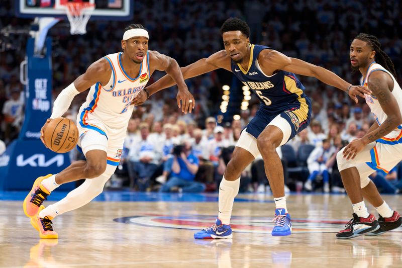 OKLAHOMA CITY, OKLAHOMA - APRIL 21: Shai Gilgeous-Alexander #2 of the Oklahoma City Thunder drives to the basket against the New Orleans Pelicans in game one of the Western Conference First Round Playoffs at the Paycom Center on April 21, 2024 in Oklahoma City, Oklahoma. NOTE TO USER: User expressly acknowledges and agrees that, by downloading and or using this photograph, User is consenting to the terms and conditions of the Getty Images License Agreement.  (Photo by Cooper Neill/Getty Images)