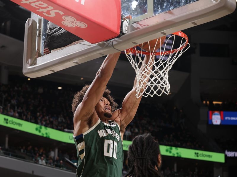 MILWAUKEE, WI - FEBRUARY 27: Jericho Sims #00 of the Milwaukee Bucks dunks the ball during the game against the Denver Nuggets on February 27, 2025 at Fiserv Forum Center in Milwaukee, Wisconsin. NOTE TO USER: User expressly acknowledges and agrees that, by downloading and or using this Photograph, user is consenting to the terms and conditions of the Getty Images License Agreement. Mandatory Copyright Notice: Copyright 2025 NBAE (Photo by Gary Dineen/NBAE via Getty Images).