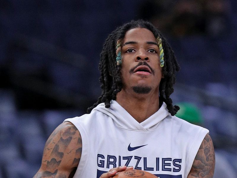 MEMPHIS, TENNESSEE - DECEMBER 02: Ja Morant #12 of the Memphis Grizzlies warms up before the game against the Philadelphia 76ers at FedExForum on December 02, 2022 in Memphis, Tennessee. NOTE TO USER: User expressly acknowledges and agrees that, by downloading and or using this photograph, User is consenting to the terms and conditions of the Getty Images License Agreement. (Photo by Justin Ford/Getty Images)