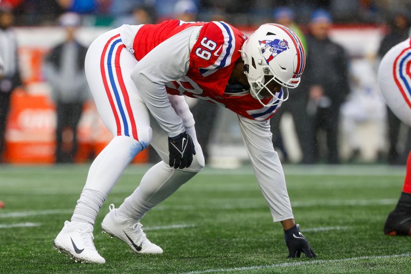 New England Patriots defensive end Keion White (99) at the line of scrimmage during the first half of an NFL football game against the Los Angeles Chargers on Sunday, Dec. 3, 2023, in Foxborough, Mass. (AP Photo/Greg M. Cooper)