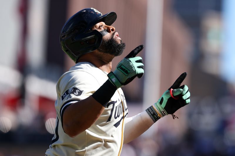 Sep 29, 2024; Minneapolis, Minnesota, USA; Minnesota Twins first baseman Carlos Santana (30) celebrates his solo home run as he runs the bases during the second inning against the Baltimore Orioles at Target Field. Mandatory Credit: Matt Krohn-Imagn Images