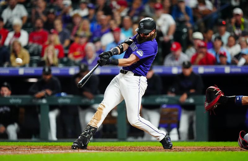 Sep 24, 2024; Denver, Colorado, USA; Colorado Rockies outfielder Charlie Blackmon (19) RBI triples in the fifth inning against the St. Louis Cardinals at Coors Field. Mandatory Credit: Ron Chenoy-Imagn Images