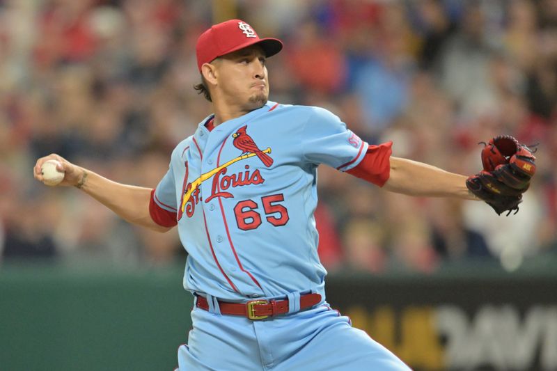 May 27, 2023; Cleveland, Ohio, USA; St. Louis Cardinals relief pitcher Giovanny Gallegos (65) throws a pitch during the tenth inning against the Cleveland Guardians at Progressive Field. Mandatory Credit: Ken Blaze-USA TODAY Sports