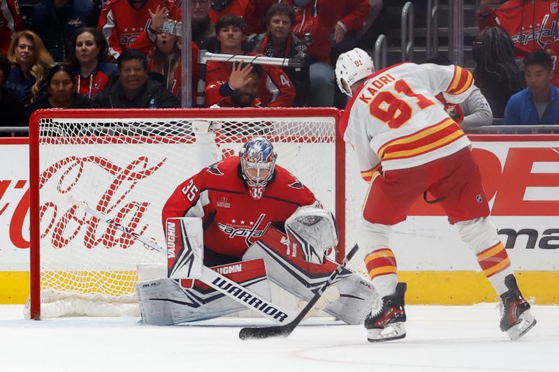 Oct 16, 2023; Washington, District of Columbia, USA; Washington Capitals goaltender Darcy Kuemper (35) prepares to make the game winning save on Calgary Flames center Nazem Kadri (91) in a shootout at Capital One Arena. Mandatory Credit: Geoff Burke-USA TODAY Sports