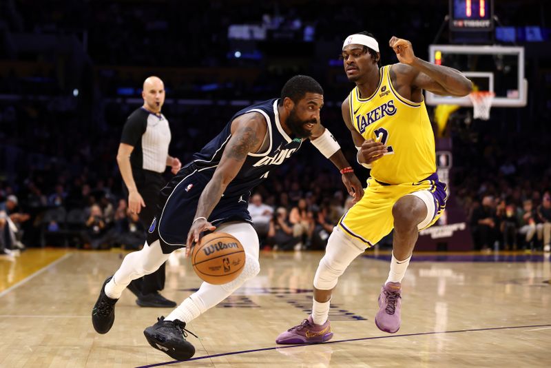 LOS ANGELES, CALIFORNIA - JANUARY 17: Kyrie Irving #11 of the Dallas Mavericks drives past Jarred Vanderbilt #2 of the Los Angeles Lakers during the second quarter at Crypto.com Arena on January 17, 2024 in Los Angeles, California. NOTE TO USER: User expressly acknowledges and agrees that, by downloading and or using this photograph, User is consenting to the terms and conditions of the Getty Images License Agreement. (Photo by Katelyn Mulcahy/Getty Images)