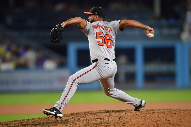 Aug 27, 2024; Los Angeles, California, USA; Baltimore Orioles pitcher Seranthony Domínguez (56) throws against the Los Angeles Dodgers during the ninth inning at Dodger Stadium. Mandatory Credit: Gary A. Vasquez-USA TODAY Sports