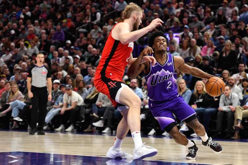 SALT LAKE CITY, UTAH - MARCH 29: Collin Sexton #2 of the Utah Jazz drives into Jock Landale #2 of the Houston Rockets during the second half of a game at Delta Center on March 29, 2024 in Salt Lake City, Utah. NOTE TO USER: User expressly acknowledges and agrees that, by downloading and or using this photograph, User is consenting to the terms and conditions of the Getty Images License Agreement.  (Photo by Alex Goodlett/Getty Images)