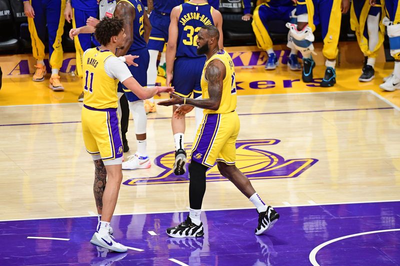 LOS ANGELES, CA - APRIL 9: Jaxson Hayes #11  and LeBron James #23  of the Los Angeles Lakers celebrate during the game against the Golden State Warriors on April 9, 2024 at Crypto.Com Arena in Los Angeles, California. NOTE TO USER: User expressly acknowledges and agrees that, by downloading and/or using this Photograph, user is consenting to the terms and conditions of the Getty Images License Agreement. Mandatory Copyright Notice: Copyright 2024 NBAE (Photo by Adam Pantozzi/NBAE via Getty Images)