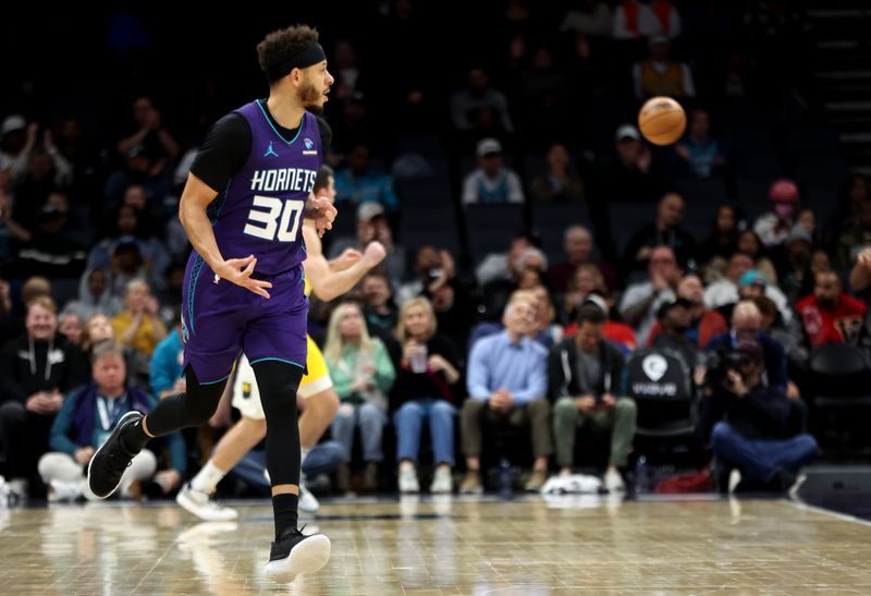 CHARLOTTE, NORTH CAROLINA - FEBRUARY 12: Seth Curry #30 of the Charlotte Hornets reacts after making a basket during the second half of an NBA game against the Indiana Pacers at Spectrum Center on February 12, 2024 in Charlotte, North Carolina. NOTE TO USER: User expressly acknowledges and agrees that, by downloading and or using this photograph, User is consenting to the terms and conditions of the Getty Images License Agreement. (Photo by David Jensen/Getty Images)