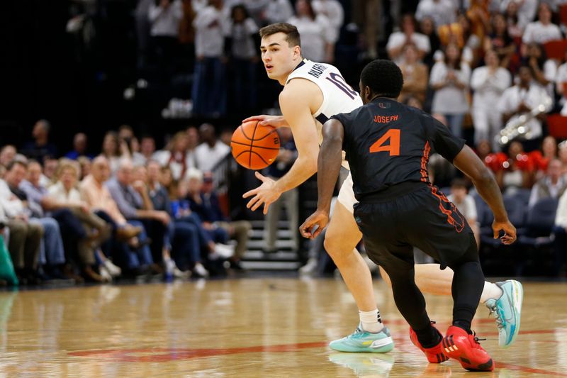 Feb 5, 2024; Charlottesville, Virginia, USA; Virginia Cavaliers guard Taine Murray (10) dribbles the ball as Miami (Fl) Hurricanes guard Bensley Joseph (4) defends during the second half at John Paul Jones Arena. Mandatory Credit: Amber Searls-USA TODAY Sports