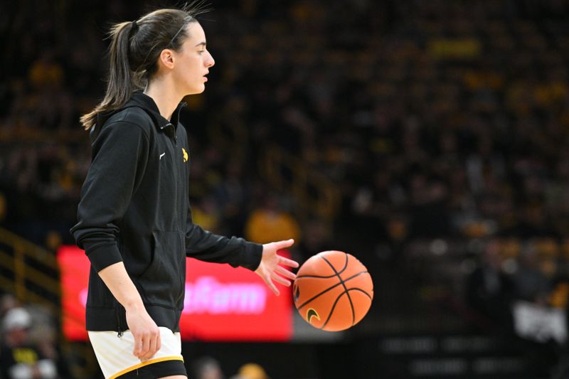 Mar 3, 2024; Iowa City, Iowa, USA; Iowa Hawkeyes guard Caitlin Clark (22) warms up before the game against the Ohio State Buckeyes at Carver-Hawkeye Arena. Clark is attempting to break the NCAA basketball all-time scoring record. Mandatory Credit: Jeffrey Becker-USA TODAY Sports