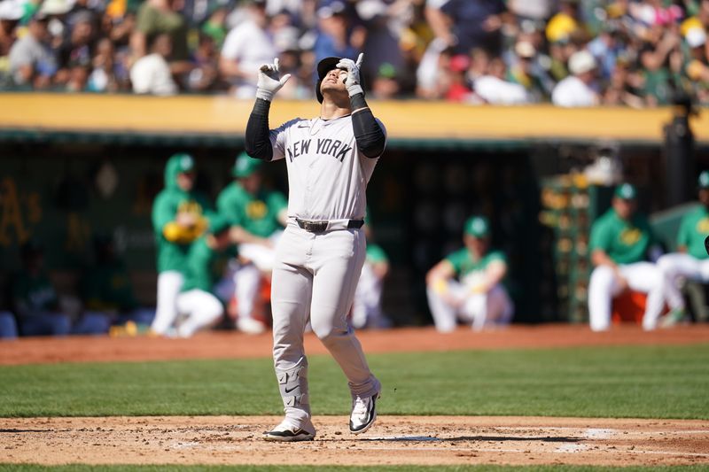 Sep 22, 2024; Oakland, California, USA; New York Yankees left fielder Jasson Dominguez (89) steps on home plate after hitting a two-run home run against the Oakland Athletics in the second inning at the Oakland-Alameda County Coliseum. Mandatory Credit: Cary Edmondson-Imagn Images