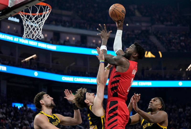 SAN FRANCISCO, CALIFORNIA - DECEMBER 23: Deandre Ayton #2 of the Portland Trail Blazers shoots over Brandin Podziemski #2 of the Golden State Warriors during the first half at Chase Center on December 23, 2023 in San Francisco, California. NOTE TO USER: User expressly acknowledges and agrees that, by downloading and or using this photograph, User is consenting to the terms and conditions of the Getty Images License Agreement. (Photo by Thearon W. Henderson/Getty Images)