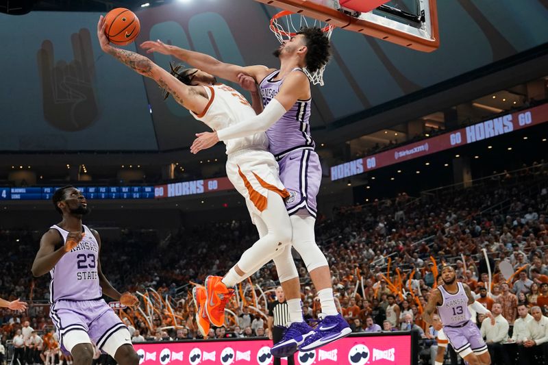 Jan 3, 2023; Austin, Texas, USA; Texas Longhorns forward Christian Bishop (32) draws a foul from Kansas State Wildcats forward Ismael Massoud (25) during the first half at Moody Center. Mandatory Credit: Scott Wachter-USA TODAY Sports