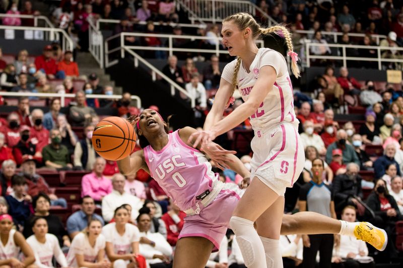 Feb 17, 2023; Stanford, California, USA;  Stanford Cardinal forward Cameron Brink (22) blocks a shot by USC Trojans forward Koi Love (0) during the first half at Maples Pavilion. Mandatory Credit: John Hefti-USA TODAY Sports