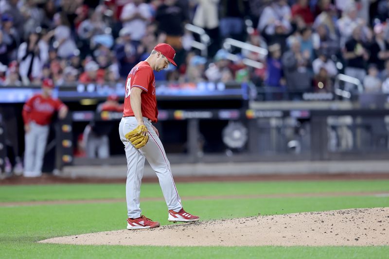 Sep 30, 2023; New York City, New York, USA; Philadelphia Phillies starting pitcher Michael Plassmeyer (49) reacts after giving up a two run home run to New York Mets catcher Francisco Alvarez (not pictured) during the second inning at Citi Field. Mandatory Credit: Brad Penner-USA TODAY Sports