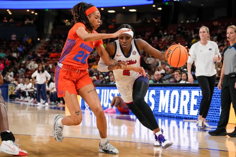 Mar 8, 2024; Greensville, SC, USA; Ole Miss Rebels guard Marquesha Davis (2) drives against Florida Gators forward Eriny Kindred (21) during the first half at Bon Secours Wellness Arena. Mandatory Credit: Jim Dedmon-USA TODAY Sports