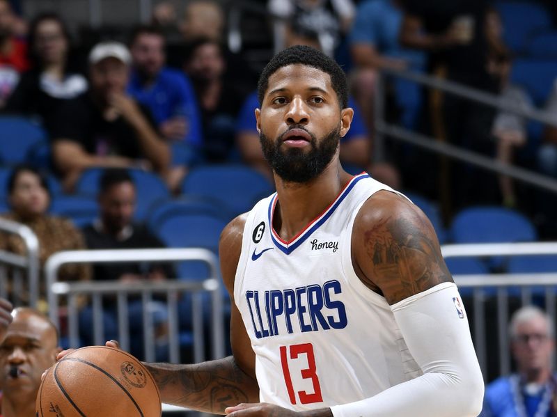 ORLANDO, FL - DECEMBER 7: Paul George #13 of the LA Clippers dribbles the ball during the game against the Orlando Magic on December 7, 2022 at Amway Center in Orlando, Florida. NOTE TO USER: User expressly acknowledges and agrees that, by downloading and or using this photograph, User is consenting to the terms and conditions of the Getty Images License Agreement. Mandatory Copyright Notice: Copyright 2022 NBAE (Photo by Fernando Medina/NBAE via Getty Images)