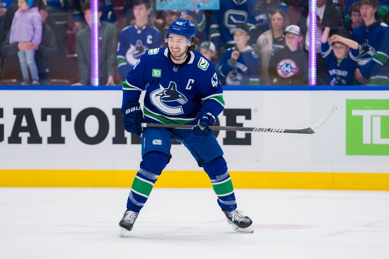 Mar 9, 2024; Vancouver, British Columbia, CAN; Vancouver Canucks defenseman Quinn Hughes (43) smiles during warm up prior to a game against the Winnipeg Jets at Rogers Arena. Mandatory Credit: Bob Frid-USA TODAY Sports