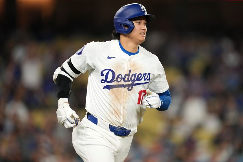 May 21, 2024; Los Angeles, California, USA; Los Angeles Dodgers designated hitter Shohei Ohtani (17) runs to first base on a single in the sixth inning against the Arizona Diamondbacks at Dodger Stadium. Mandatory Credit: Kirby Lee-USA TODAY Sports