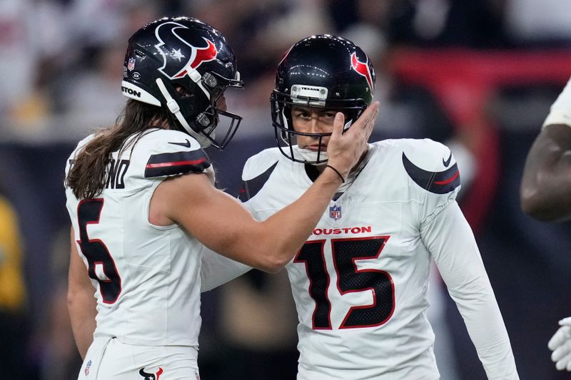 Houston Texans kicker Ka'imi Fairbairn (15) is congratulated by Tommy Townsend (6) after making a 53-yard field goal during the second half of an NFL football game against the Chicago Bears Sunday, Sept. 15, 2024, in Houston. (AP Photo/Eric Gay)