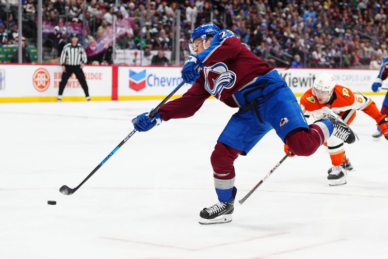 Oct 18, 2024; Denver, Colorado, USA; Colorado Avalanche center Nathan MacKinnon (29) shoots the puck in the second period against the Anaheim Ducks at Ball Arena. Mandatory Credit: Ron Chenoy-Imagn Images