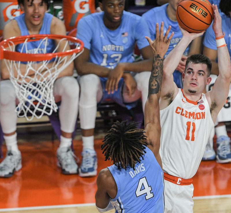 Jan 6, 2024; Clemson, South Carolina, USA; Clemson graduate Joseph Girard III  shoots near University of North Carolina guard RJ Davis (4) during the first half  at Littlejohn Coliseum. Mandatory Credit: Ken Ruinard-USA TODAY Sports