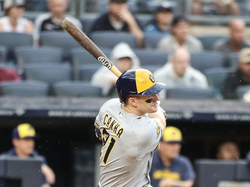 Sep 9, 2023; Bronx, New York, USA;  Milwaukee Brewers right fielder Mark Canha (21) hits a single in the fourth inning against the New York Yankees at Yankee Stadium. Mandatory Credit: Wendell Cruz-USA TODAY Sports