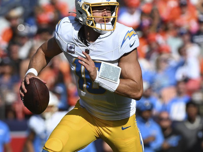 Los Angeles Chargers quarterback Justin Herbert (10) looks to pass during the first half of an NFL football game against the Denver Broncos, Sunday, Oct. 13, 2024, in Denver. (AP Photo/Geneva Heffernan)