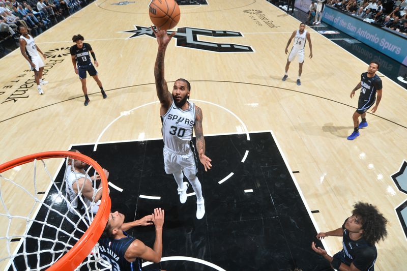 SAN ANTONIO, TX - OCTOBER 9: Julian Champagnie #30 of the San Antonio Spurs shoots the ball during the game against the Orlando Magic during a NBA preseason game on October 9, 2024 at the Frost Bank Center in San Antonio, Texas. NOTE TO USER: User expressly acknowledges and agrees that, by downloading and or using this photograph, user is consenting to the terms and conditions of the Getty Images License Agreement. Mandatory Copyright Notice: Copyright 2024 NBAE (Photos by Michael Gonzales/NBAE via Getty Images)