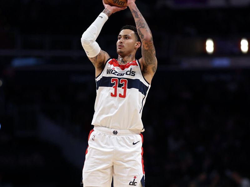 WASHINGTON, DC - MARCH 21: Kyle Kuzma #33 of the Washington Wizards shoots the ball against the Sacramento Kings during the first half at Capital One Arena on March 21, 2024 in Washington, DC. NOTE TO USER: User expressly acknowledges and agrees that, by downloading and or using this photograph, User is consenting to the terms and conditions of the Getty Images License Agreement. (Photo by Patrick Smith/Getty Images)