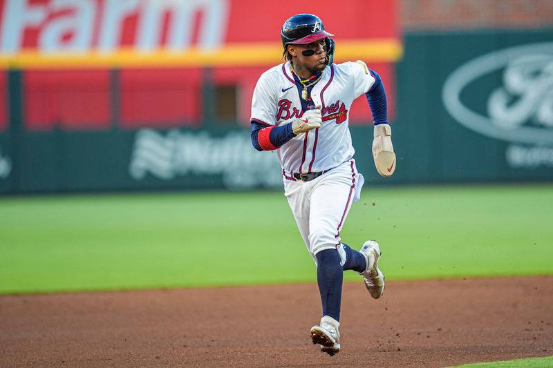 Apr 21, 2024; Cumberland, Georgia, USA; Atlanta Braves right fielder Ronald Acuna Jr (13) runs the bases against the Texas Rangers during the first inning at Truist Park. Mandatory Credit: Dale Zanine-USA TODAY Sports