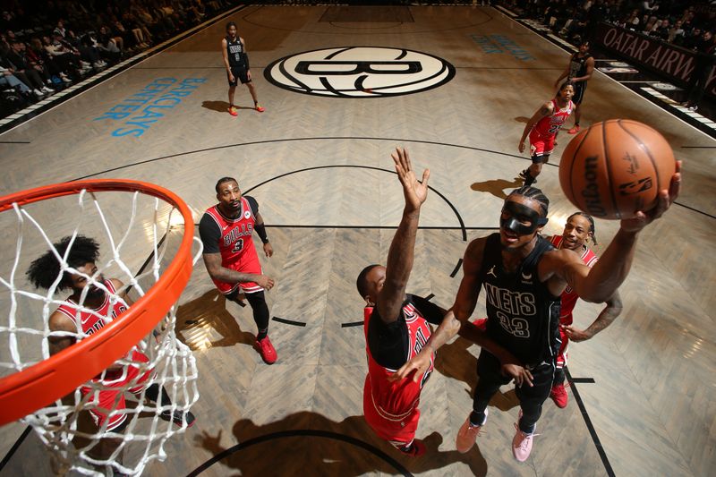 BROOKLYN, NY - MARCH 29: Nicolas Claxton #33 of the Brooklyn Nets drives to the basket during the game against the Chicago Bulls on March 29, 2024 at Barclays Center in Brooklyn, New York. NOTE TO USER: User expressly acknowledges and agrees that, by downloading and or using this Photograph, user is consenting to the terms and conditions of the Getty Images License Agreement. Mandatory Copyright Notice: Copyright 2024 NBAE (Photo by Nathaniel S. Butler/NBAE via Getty Images)